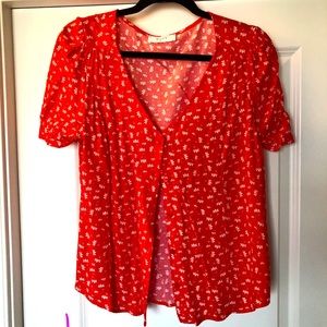 Button up red flowy top with white floral details